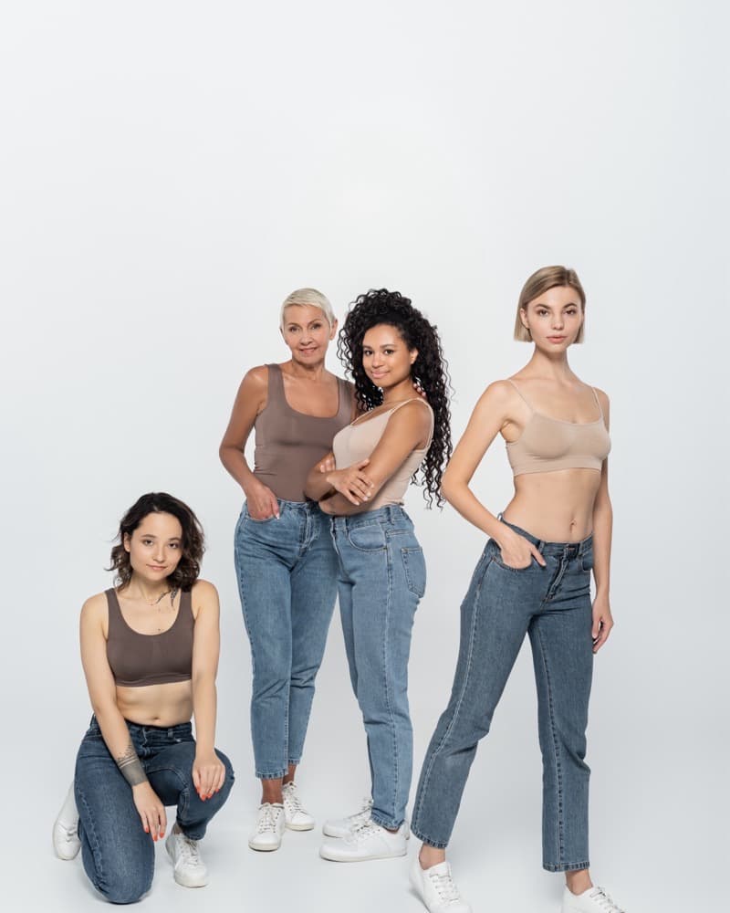 Models of different heights, ages and builds, standing on the same standard