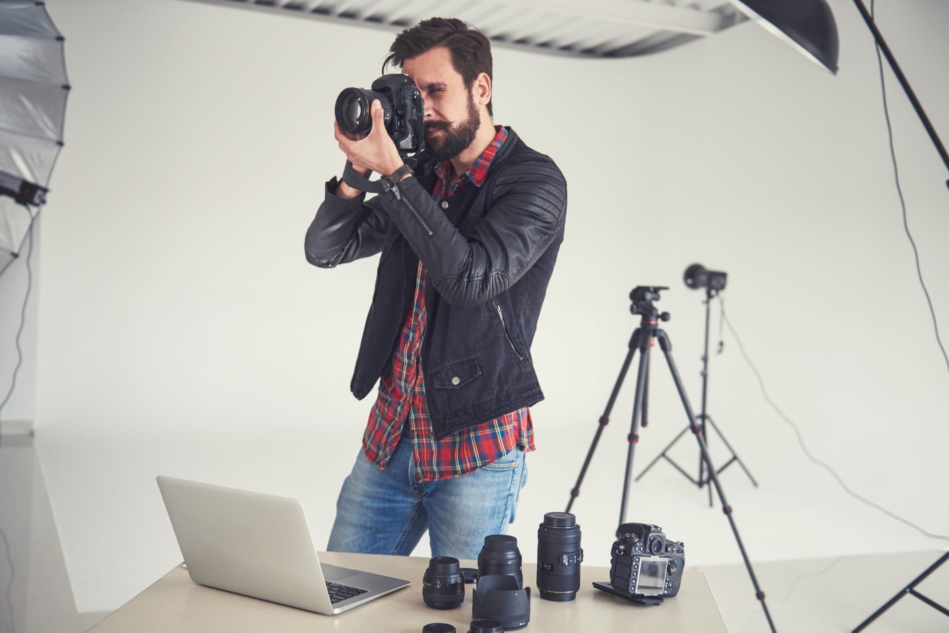 An official photographer at work in the studio, shooting to the SUPREMES standard